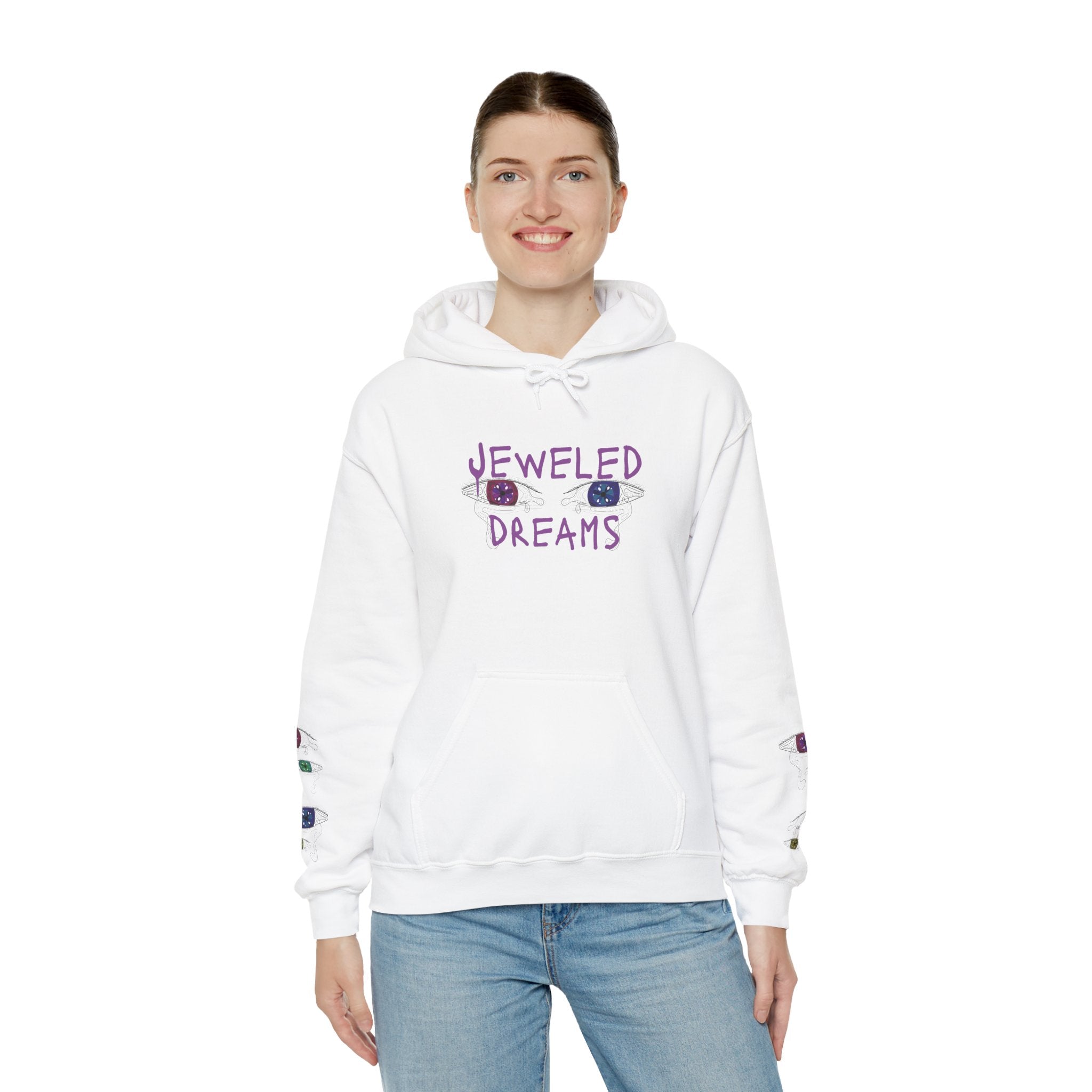 Person wearing a white hoodie with 'Jeweled Dreams' text and graphics on a white background